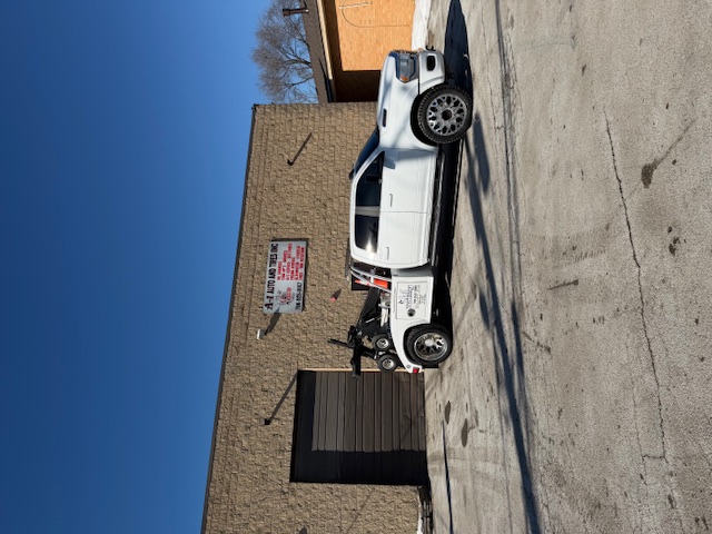 A-1 Auto & Tires tow truck outside the Chicago shop